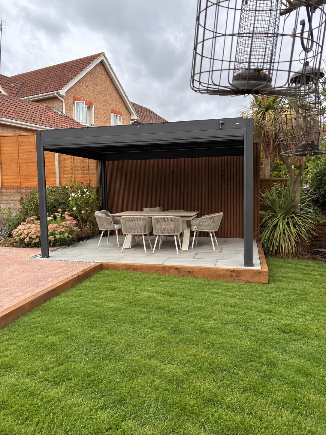 Modern pergola over porcelain patio with outdoor dining set
